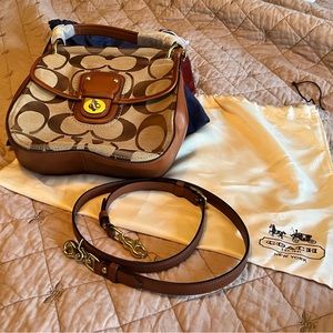 Small Tan and Brown Coach Shoulder Bag with Brown Leather Strap and Turn lock.